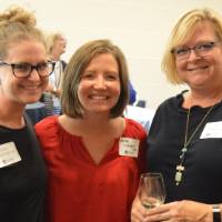 Three alumnae posing for a photo